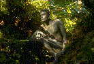 Male Model as Gargoyle in forest