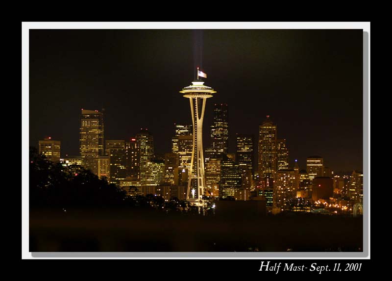 Seattle Space Needle illuminating its colors at halfmast
