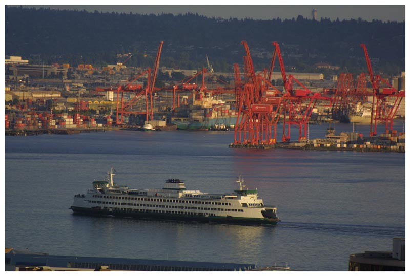 Seattle ferry inbound from Bainbridge Island on Eliott Bay. Near Sunset looking south at Harbor Island and south Seattle
