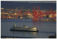 Seattle ferry inbound from Bainbridge Island on Eliott Bay. Near Sunset looking south at Harbor Island and south Seattle